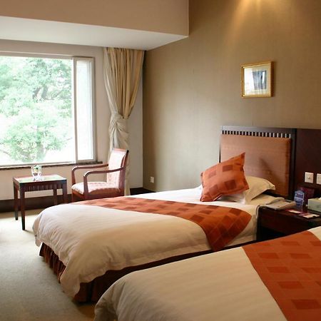 Suzhou Taoyuan International Holiday Hotel Quarto foto