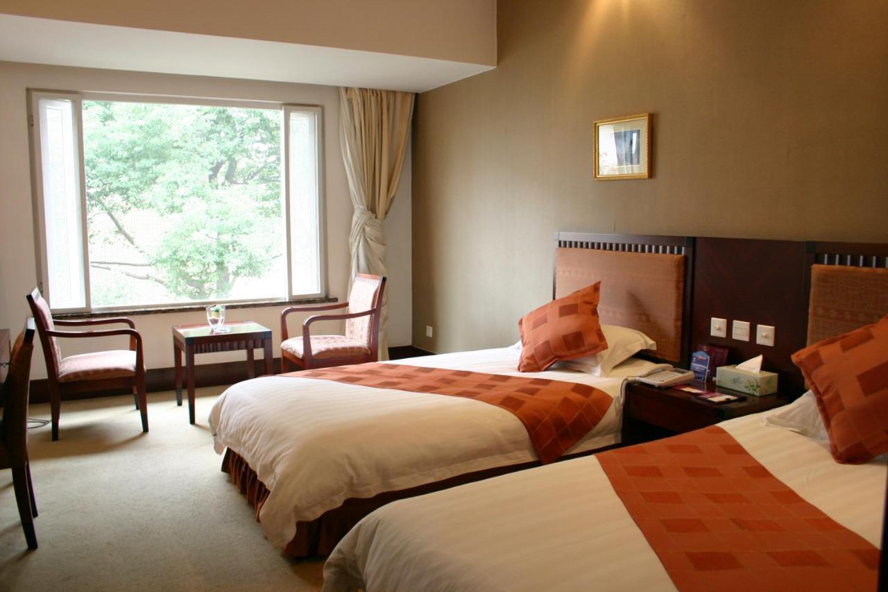 Suzhou Taoyuan International Holiday Hotel Quarto foto